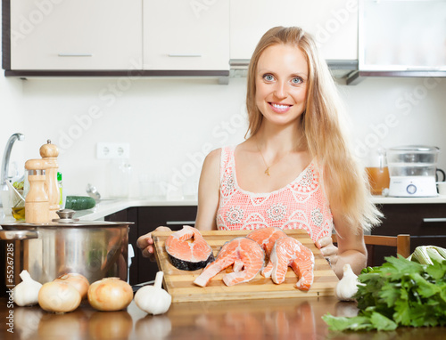 Photo: Blonde woman with salmon Blonde woman with salmon