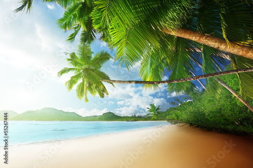 Photo: sunset on beach Anse Takamaka of Mahe island, seychelles sunset on beach Anse Takamaka of Mahe island, seychelles