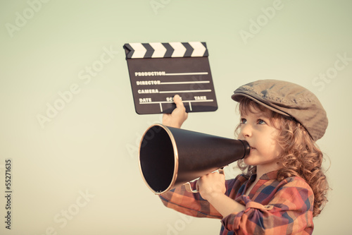 Photo: Kid shouting through megaphone Kid shouting through megaphone