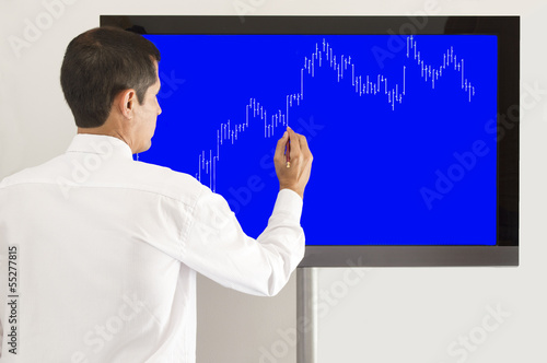 Photo: businessman presenting the graph businessman presenting the graph
