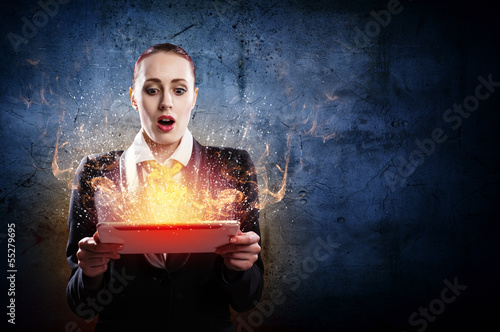 Photo: Young business woman with ipad Young business woman with ipad