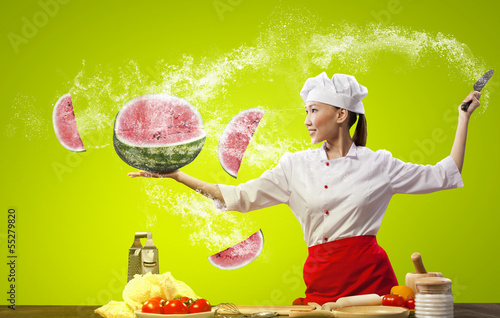 Photo: Asian female cook with knife Asian female cook with knife