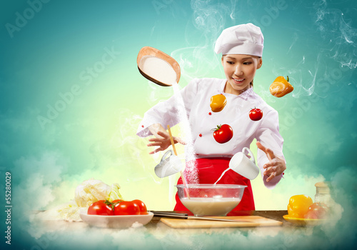 Photo: Asian female cooking with magic Asian female cooking with magic