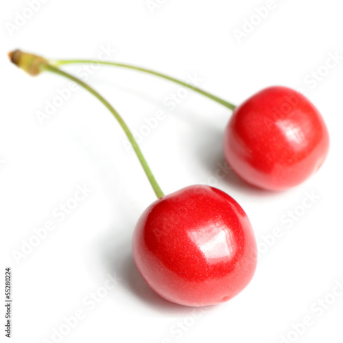 Photo: Two Red Sweet Cherries Isolated on White Background Two Red Sweet Cherries Isolated on White Background