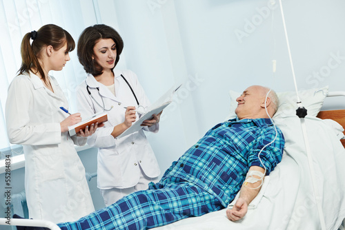 Photo: medic doctor in hospital with patient medic doctor in hospital with patient
