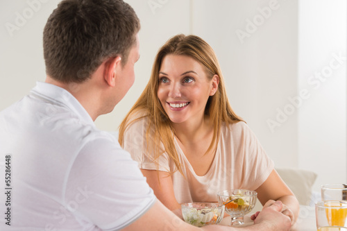 Photo: Happy couple eating at home Happy couple eating at home