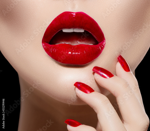 Photo: Red Sexy Lips and Nails closeup. Manicure and Makeup Red Sexy Lips and Nails closeup. Manicure and Makeup