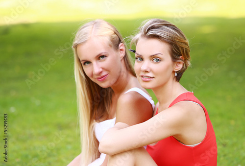 Photo: Two girls are having fun in the park Two girls are having fun in the park