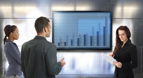 Photo: Young businesspeople discussing results Young businesspeople discussing results