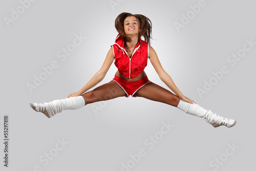Photo: Young female dancer against white background Young female dancer against white background