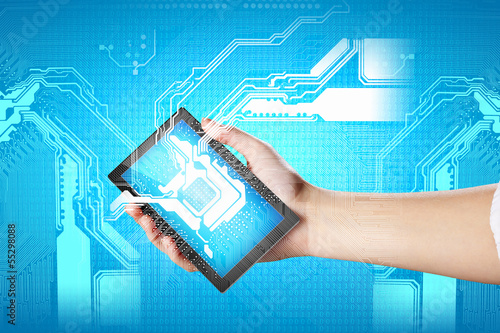 Photo: Closeup of human hands holding ipad Closeup of human hands holding ipad