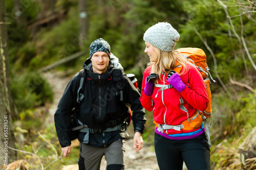 Photo: Couple hikers in mountains Couple hikers in mountains