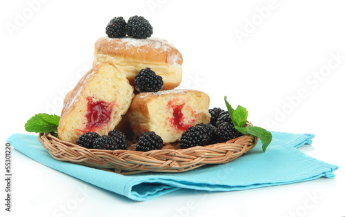 Photo: Tasty donuts with berries, isolated on white Tasty donuts with berries, isolated on white