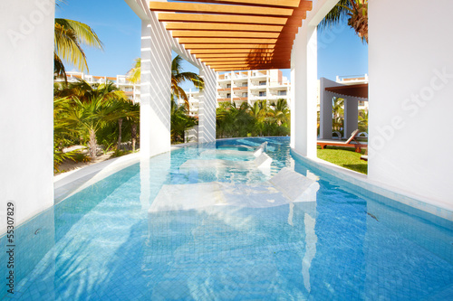 Photo: Swimming pool at caribbean resort. Swimming pool at caribbean resort.
