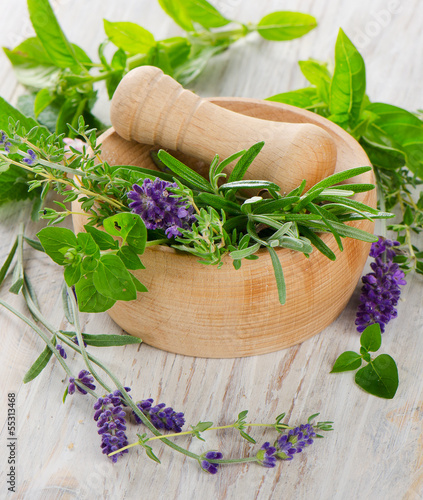 Photo: Mortar with fresh herbs Mortar with fresh herbs
