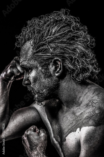 Photo: Sculpture man, young classic warrior with bodypainting Sculpture man, young classic warrior with bodypainting