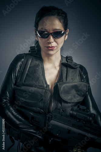 Photo: Police woman with latex costume Police woman with latex costume