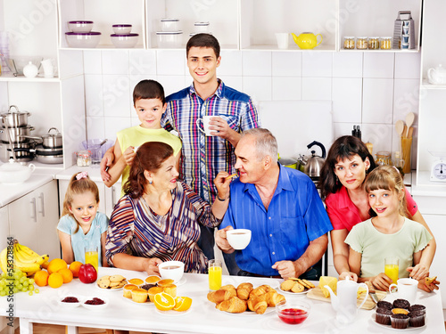 Photo: Big happy family have breakfast. Big happy family have breakfast.