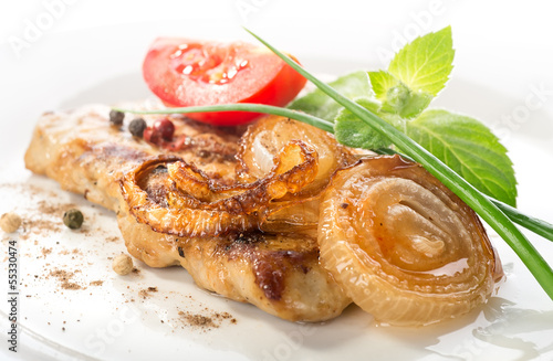 Photo: Pork steak with tomato and onion Pork steak with tomato and onion