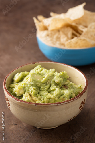 Photo: Bowl of guacamole on table Bowl of guacamole on table