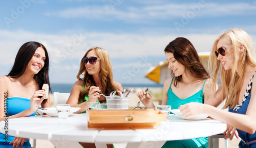 Photo: girls in cafe on the beach girls in cafe on the beach