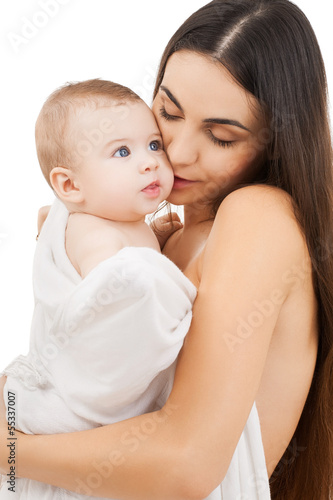 Photo: mother kissing adorable baby mother kissing adorable baby