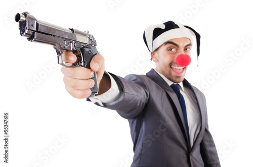 Photo: Businessman clown with gun isolated on white Businessman clown with gun isolated on white