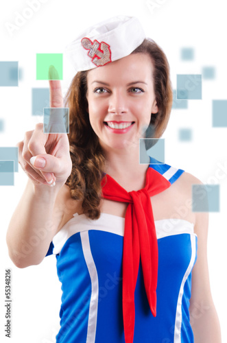 Photo: Young woman sailorpressing virtual buttons Young woman sailorpressing virtual buttons