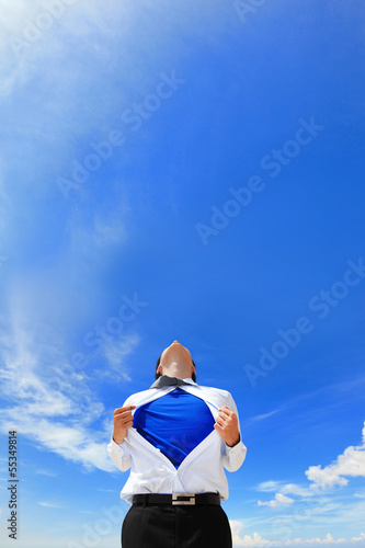 Photo: Business man showing superhero suit Business man showing superhero suit