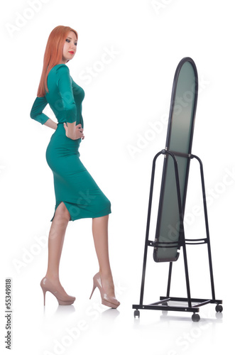 Photo: Woman trying new clothing on white Woman trying new clothing on white