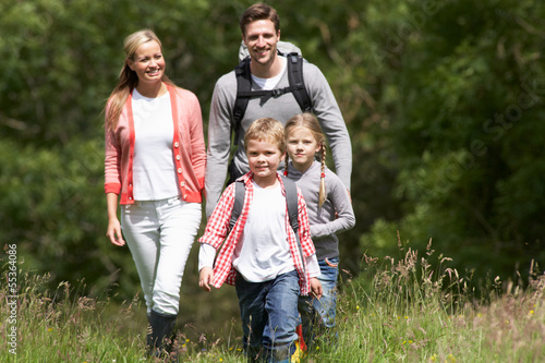 Photo: Family Hiking In Countryside Family Hiking In Countryside