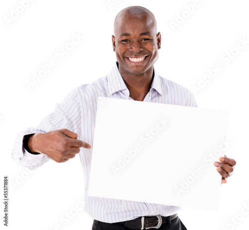 Photo: Business man pointing a banner Business man pointing a banner