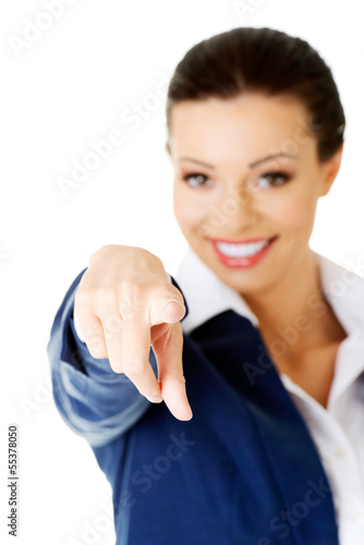 Photo: Young beautiful caucasian business woman pointing on you Young beautiful caucasian business woman pointing on you