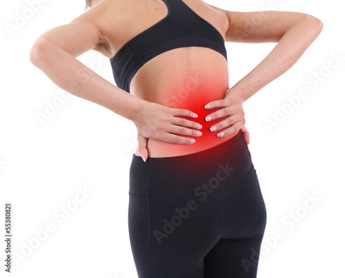 Photo: Lower back pain in woman isolated on white Lower back pain in woman isolated on white
