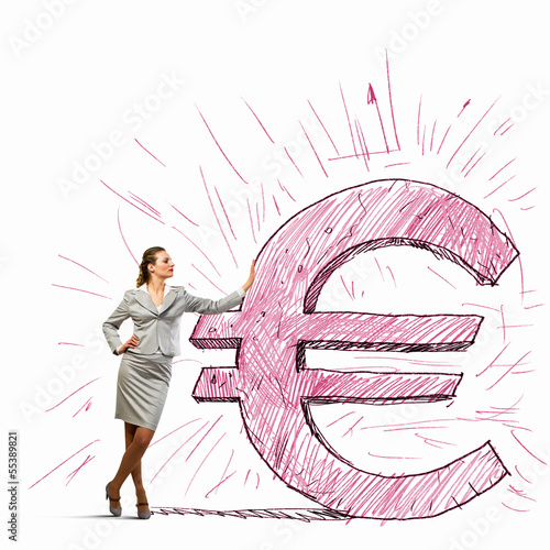Photo: Businesswoman leaning on euro sign Businesswoman leaning on euro sign