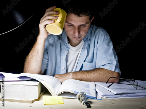 Photo: Young Man Studying at Night Young Man Studying at Night