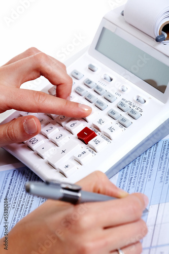 Photo: Hands of business people with calculator. Hands of business people with calculator.