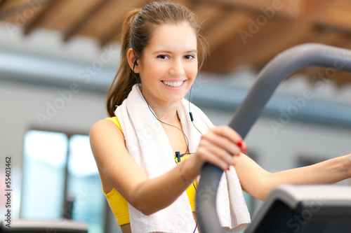 Photo: Woman running on a treadmill Woman running on a treadmill