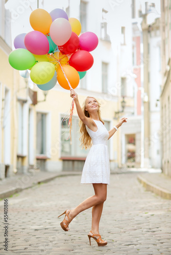 Photo: woman with colorful balloons woman with colorful balloons
