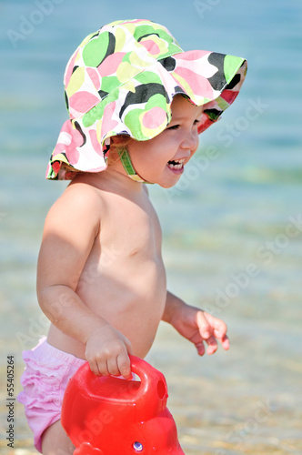 Photo: happy baby on the beach happy baby on the beach