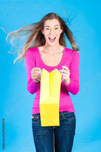 Photo: woman with colored shopping bags woman with colored shopping bags
