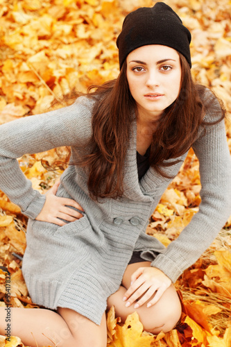 Photo: Autumn woman on leafs background Autumn woman on leafs background