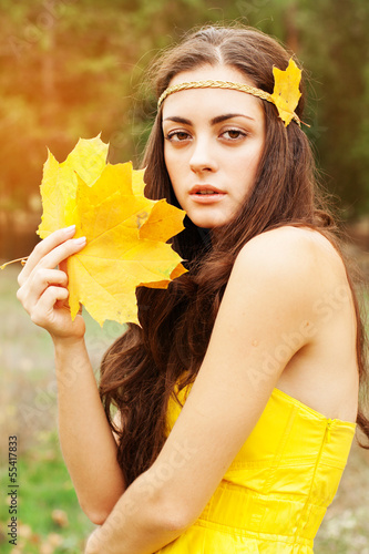 Photo: Autumn woman on leafs background Autumn woman on leafs background