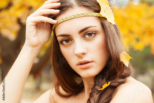 Photo: Autumn woman on leafs background Autumn woman on leafs background
