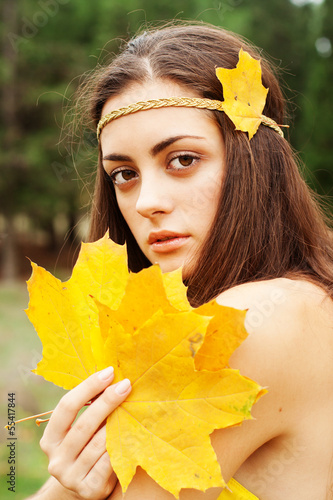 Photo: Autumn woman on leafs background Autumn woman on leafs background