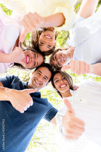 Photo: Group of friends with thumbs up Group of friends with thumbs up