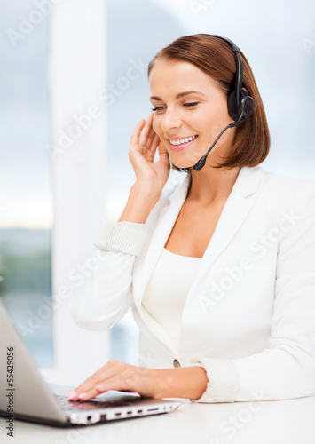 Photo: friendly female helpline operator friendly female helpline operator