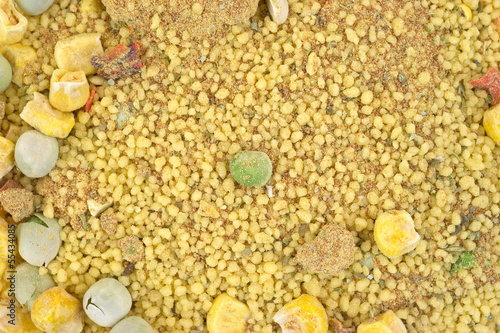 Photo: Close view of dry couscous, vegetables and seasoning Close view of dry couscous, vegetables and seasoning