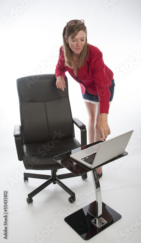 Photo: Female office worker wearing a red jacket Female office worker wearing a red jacket