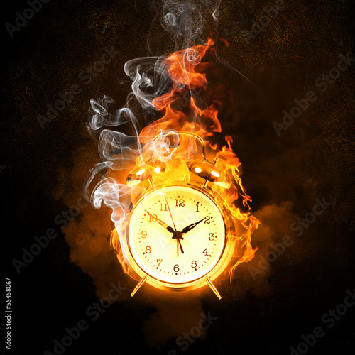 Photo: Alarm clock in fire Alarm clock in fire
